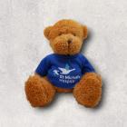 Fluffy brown teddy bear wears blue shirt with St Michael's Hospice logo.