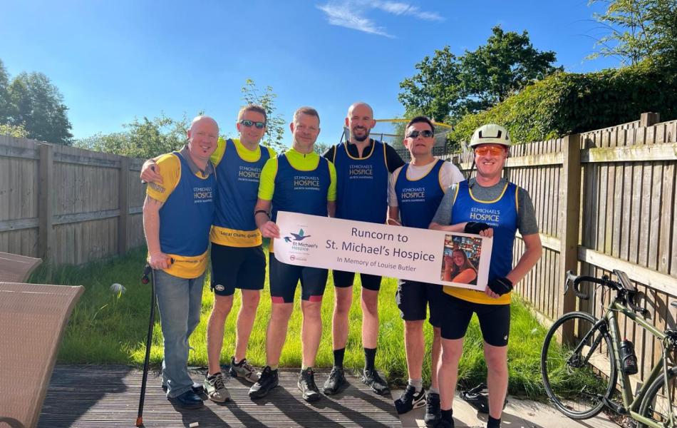 6 cyclists with a cheque 