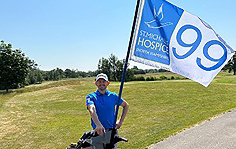 Golfer with St. Michaels' Hospice Flag