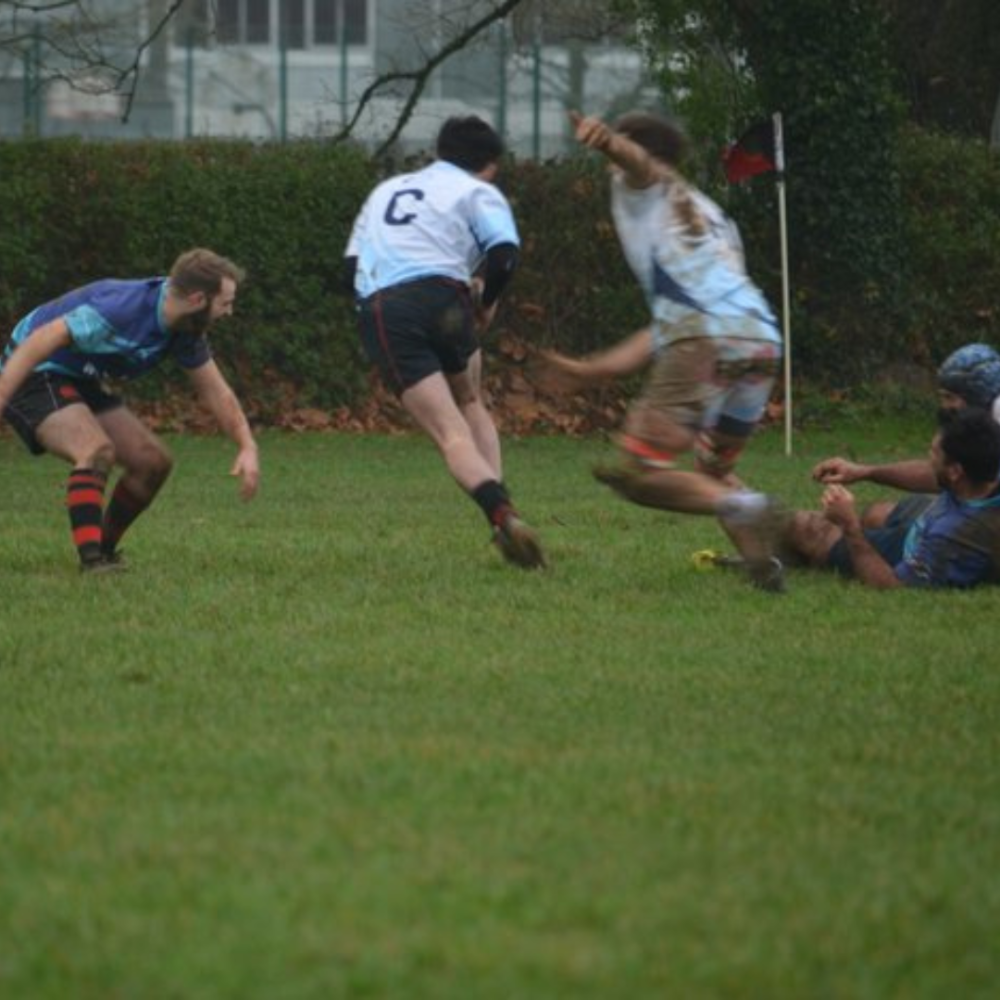 4 people playing rugby